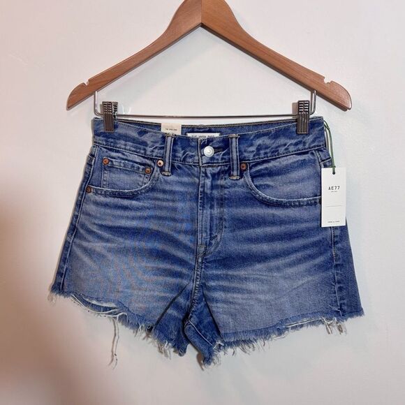 AE77  American Eagle The High Rise Cuff-OFF Medium Wash 27 Jean Shorts NEW - Picture 1 of 13